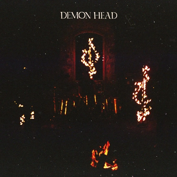 DEMON HEAD / THROUGH HOLES SHINE THE STARS