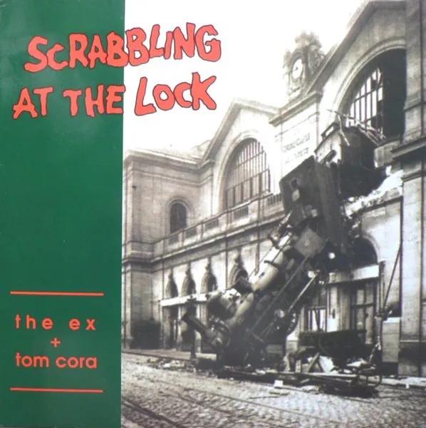 EX / TOM CORA / SCRABBLING AT THE LOCK